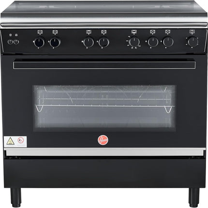 موقد غاز هوفر 90×60 بوصة بخمسة شعلات غاز (واحدة منها مخصصة للووك)، مزود بميزات أمان كاملة، وفرن غاز وشواية، وإشعال تلقائي، ودعامة من الحديد الزهر، ومروحة مزدوجة لتوزيع الحرارة، وباب زجاجي مزدوج، وضمان لمدة عام واحد، لون أسود -HGC-G95G-RB