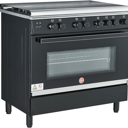 موقد غاز هوفر 90×60 بوصة بخمسة شعلات غاز (واحدة منها مخصصة للووك)، مزود بميزات أمان كاملة، وفرن غاز وشواية، وإشعال تلقائي، ودعامة من الحديد الزهر، ومروحة مزدوجة لتوزيع الحرارة، وباب زجاجي مزدوج، وضمان لمدة عام واحد، لون أسود -HGC-G95G-RB